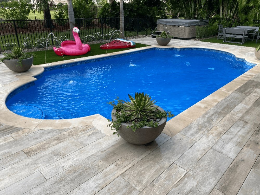 Freshly remodeled backyard pool with fountains in Palm Beach County